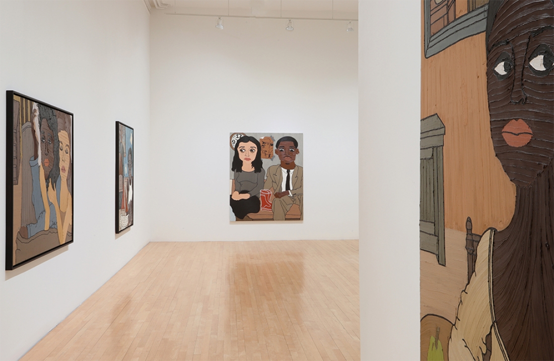 installation of large paintings in gallery 