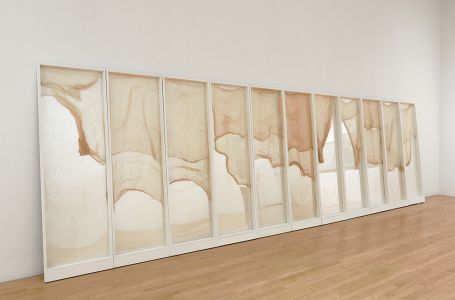 eleven part wall piece with wood and mirrors and gauze