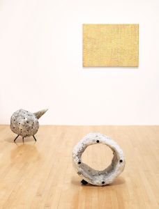 two sculptures one painting