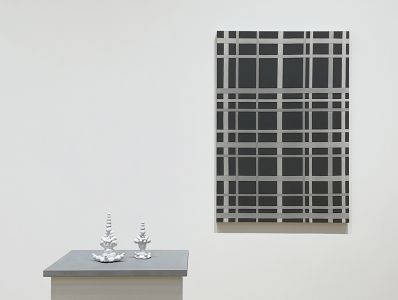 small white ceramic sculptures with black and white painting