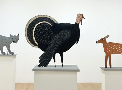 Turkey, with Bobcat and Deer sculptures